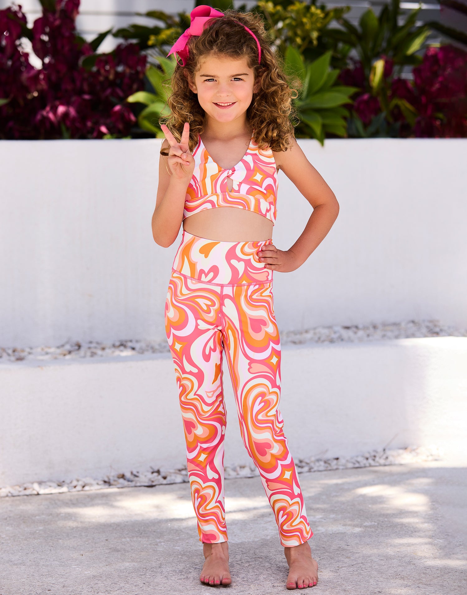Katie Child Legging by California Kisses in Pink Multi – Front View
